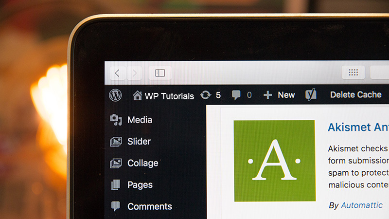 WordPress admin area on a black laptop.