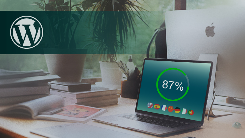 WordPress logo near a progress circle on a laptop screen.